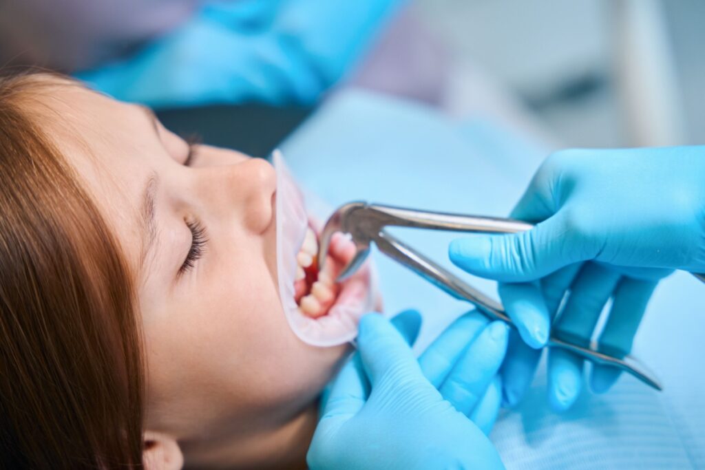 A child having an emergency tooth removal at a dental office.