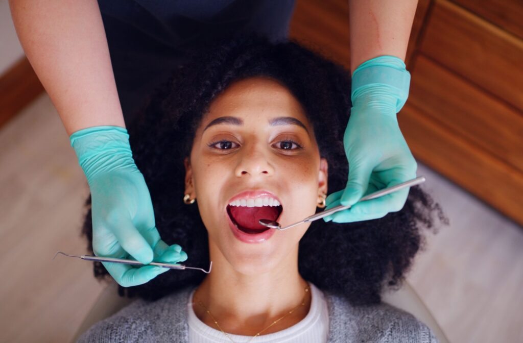 A person getting their teeth examined during a routine dental appointment