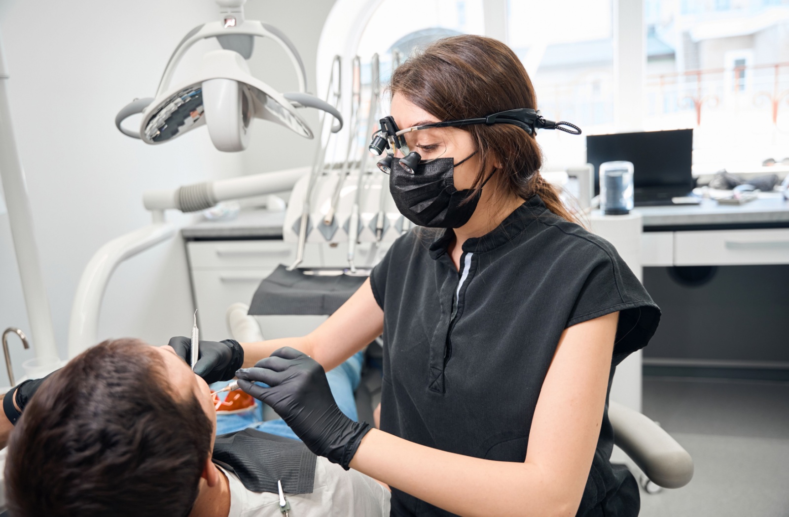 A dentist working on a patients root canal
